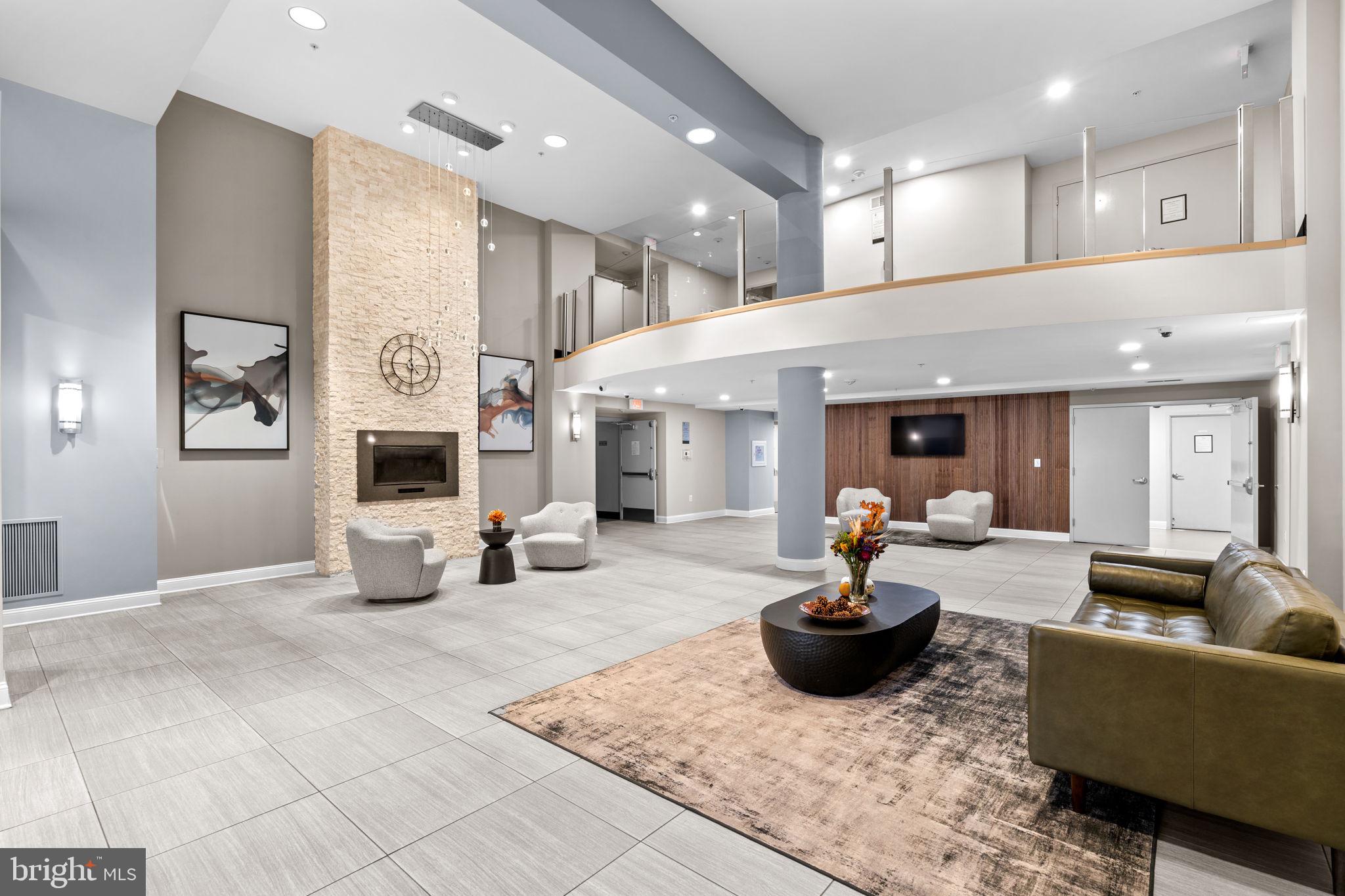 6301 Edsall Road, Unit 500 Alexandria, VA 22312 - Photo 19 of 30 a living room with furniture and a fireplace
