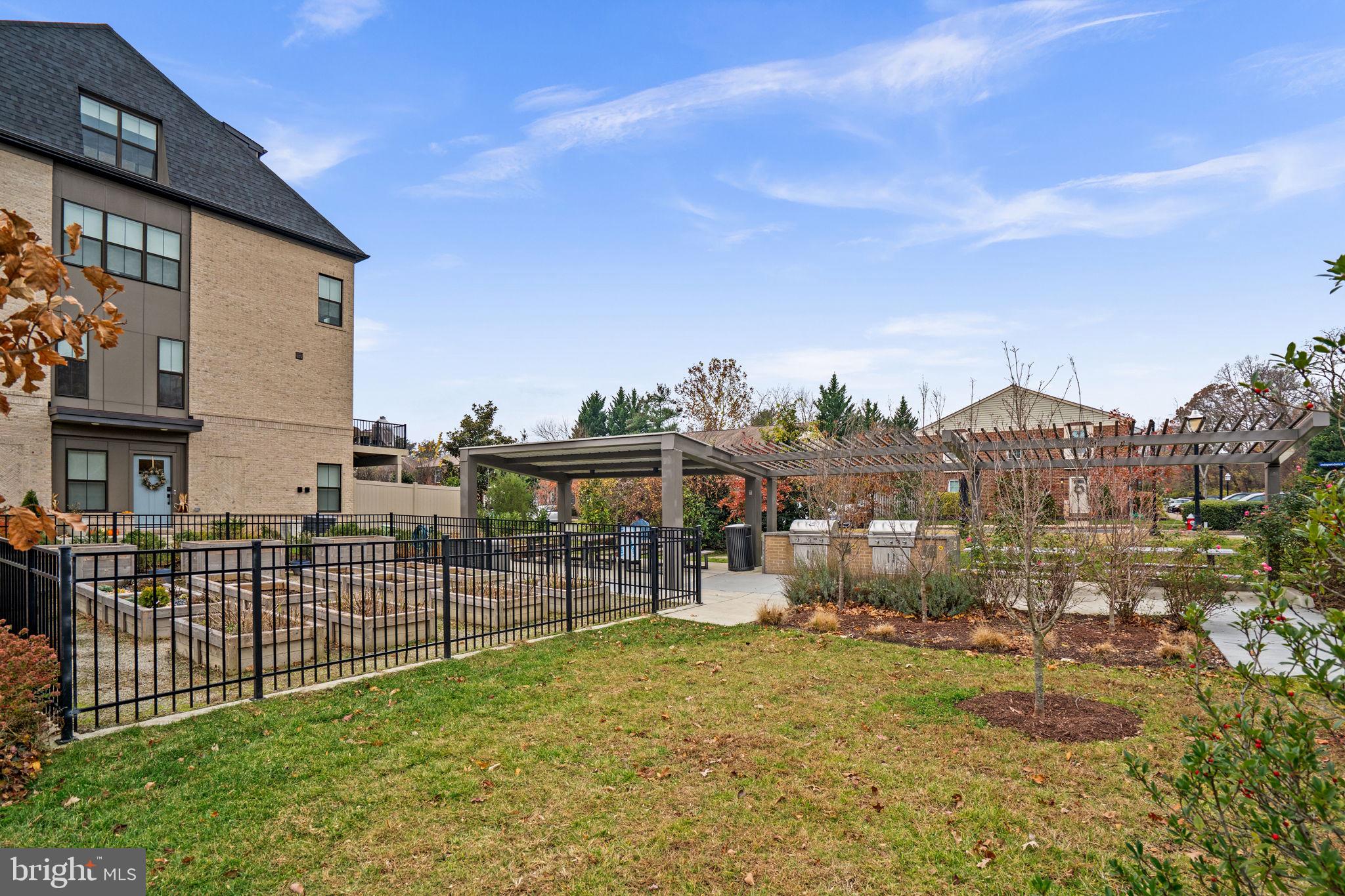 6301 Edsall Road, Unit 500 Alexandria, VA 22312 - Photo 28 of 30 a view of a house with a yard and potted plants