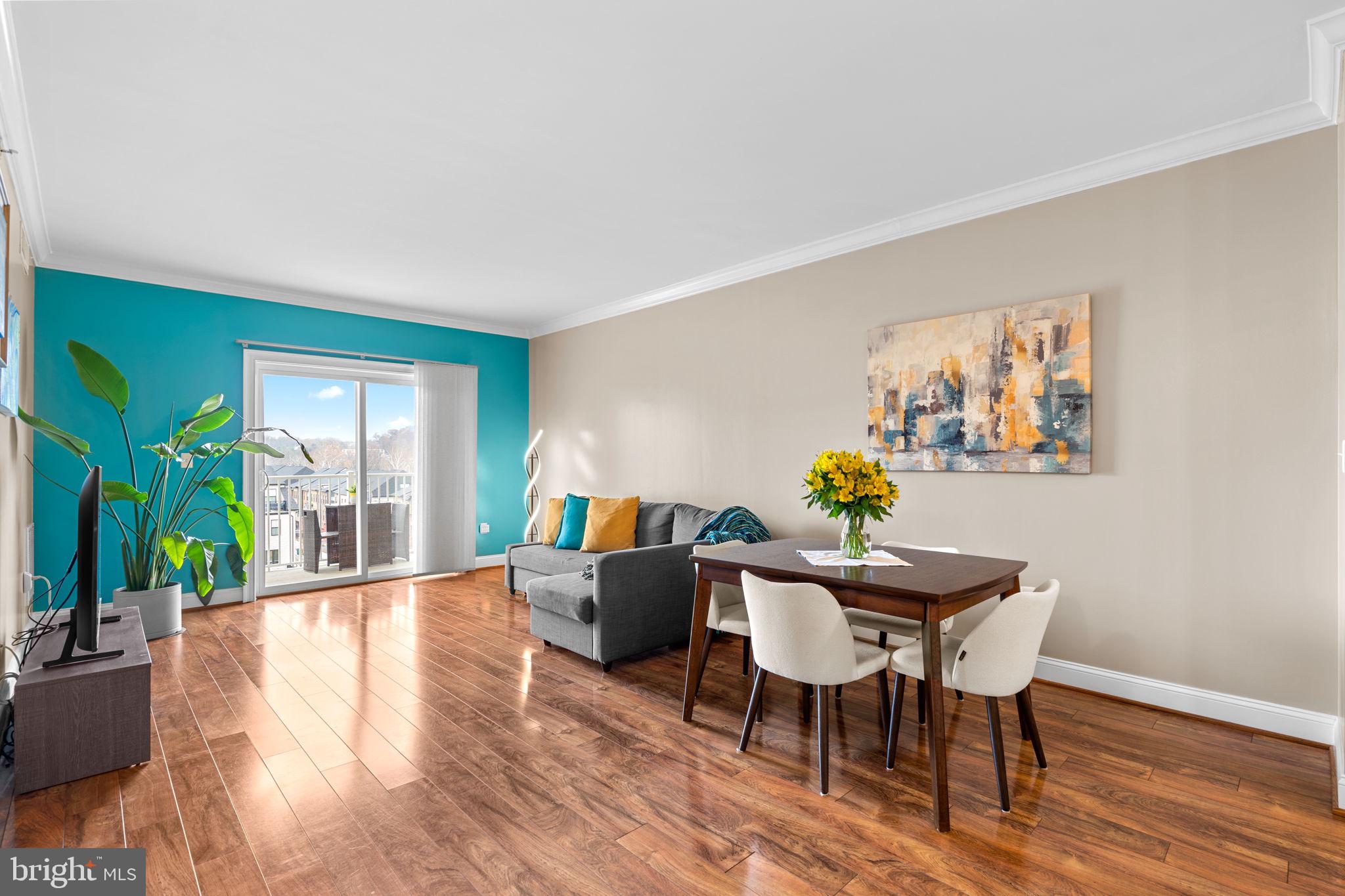 6301 Edsall Road, Unit 500 Alexandria, VA 22312 - Photo 8 of 30 a view of a dining room with furniture window and wooden floor