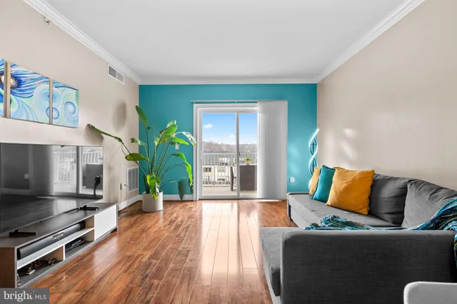 a living room with furniture flat screen tv and a fireplace
