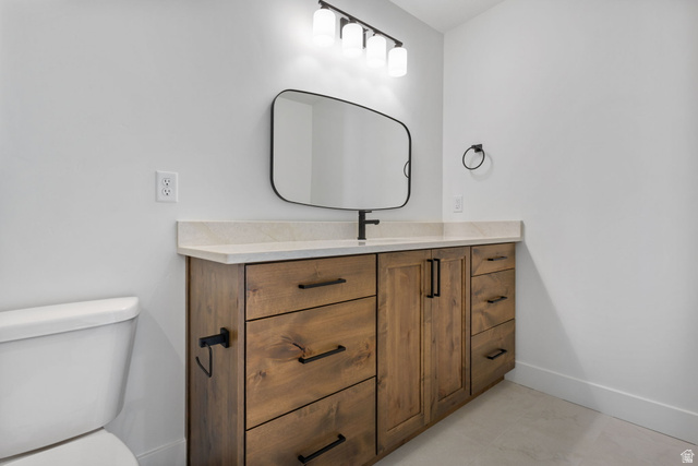 692 East Mountain Road North Ogden, UT 84414 - Photo 22 of 35 Expansive wood-finish vanity with multiple drawers and cabinet storage