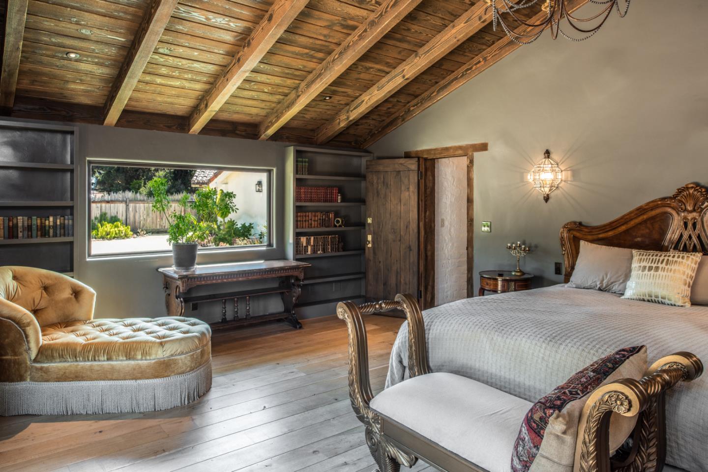 34 Rancho Road Carmel Valley, CA 93924 - Photo 15 of 22 a bedroom with furniture and a large window