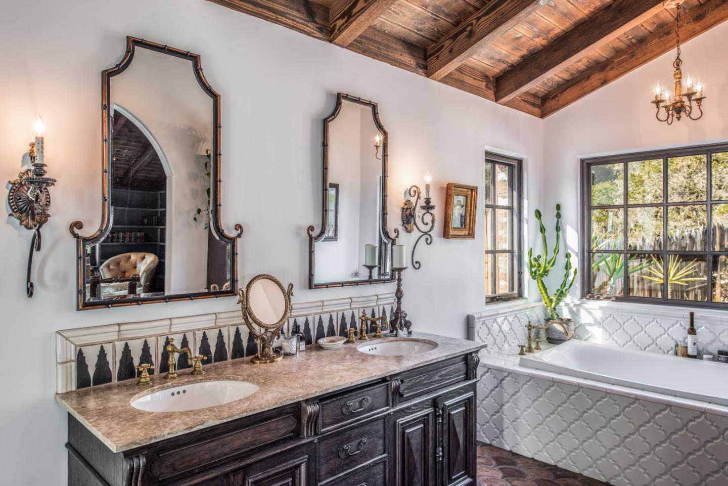 34 Rancho Road Carmel Valley, CA 93924 - Photo 17 of 22 a bathroom with a granite countertop sink and a mirror
