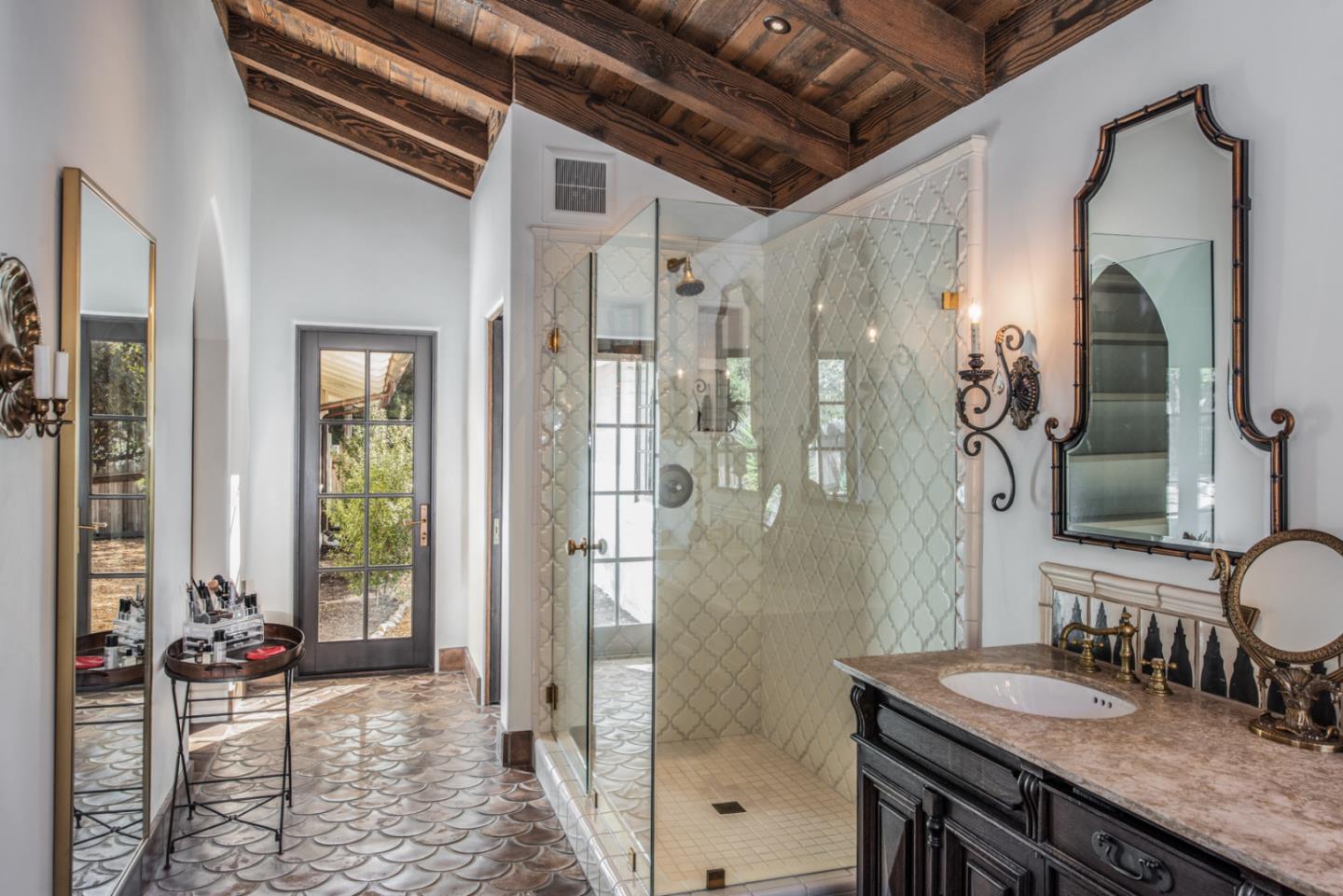 34 Rancho Road Carmel Valley, CA 93924 - Photo 18 of 22 a bathroom with a granite countertop sink a mirror a bathtub and shower