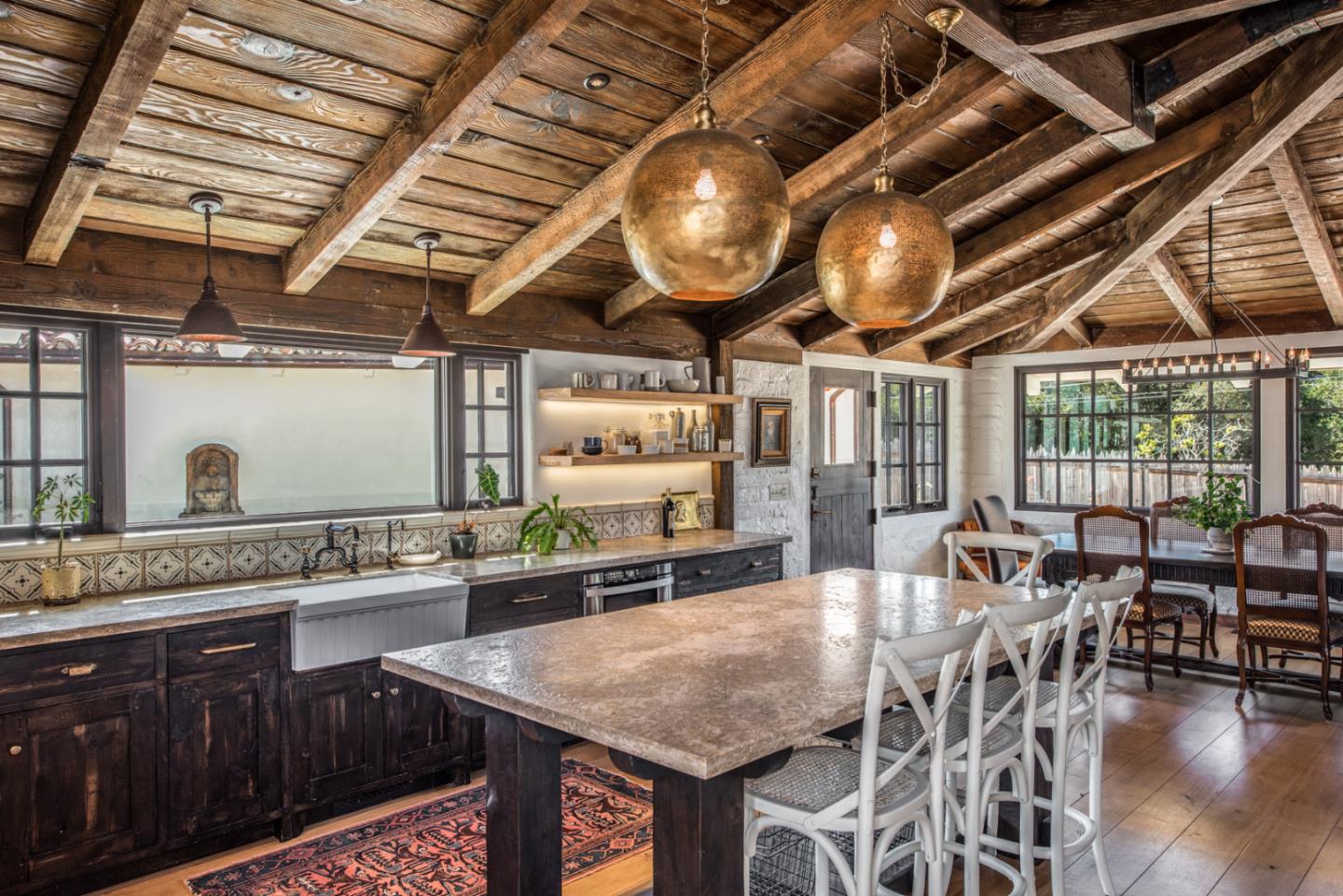 34 Rancho Road Carmel Valley, CA 93924 - Photo 8 of 22 a kitchen with stainless steel appliances granite countertop a sink a stove and a wooden cabinets