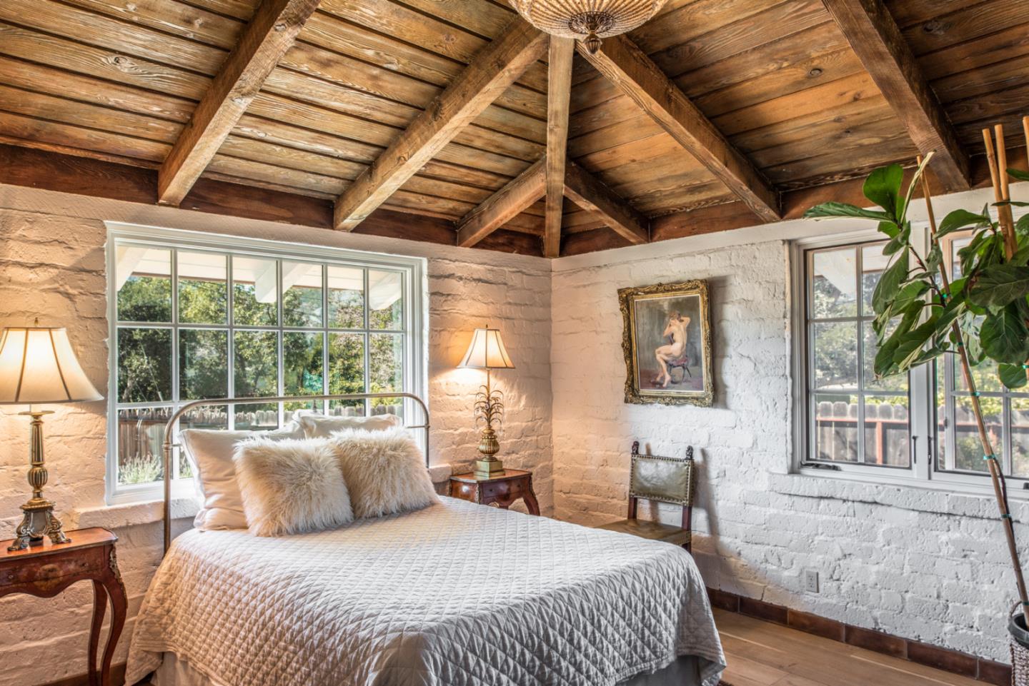 34 Rancho Road Carmel Valley, CA 93924 - Photo 10 of 22 a bedroom with a large bed and a large window