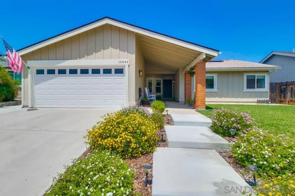 10544 Cadwell Road Santee, CA 92071 - Photo 1 of 27 a front view of a house with garden