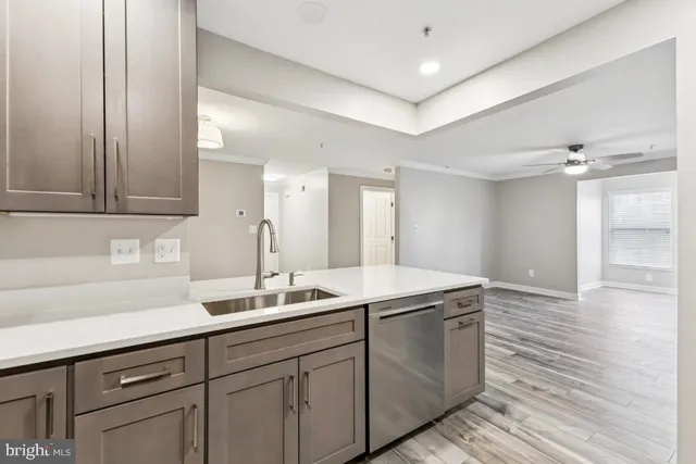 a kitchen with a sink and cabinets