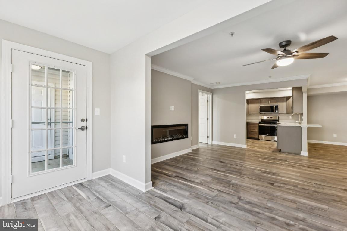 8311 A Bluebird Way, Unit A Lorton, VA 22079 - Photo 14 of 25 a view of empty room with wooden floor and window