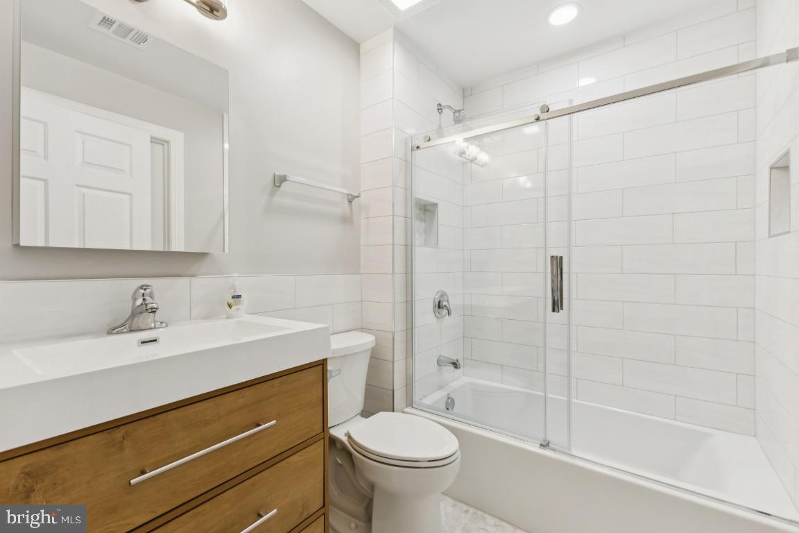 8311 A Bluebird Way, Unit A Lorton, VA 22079 - Photo 16 of 25 a bathroom with a sink a toilet and a bathtub