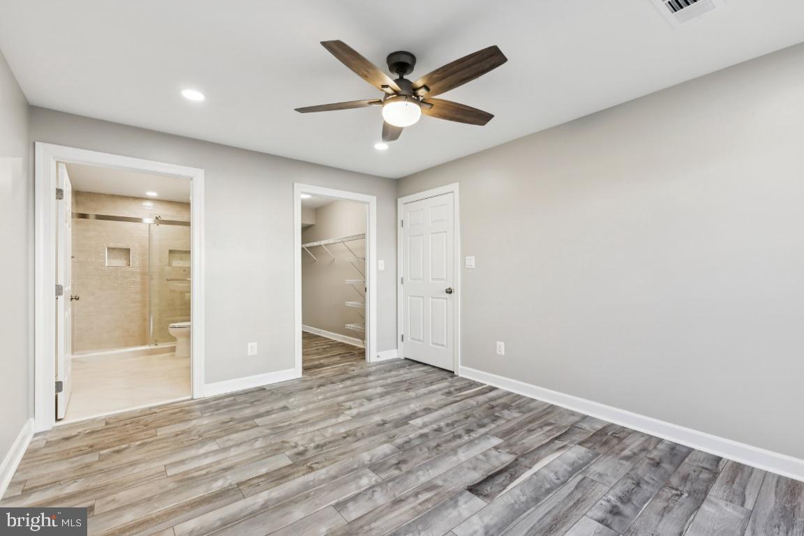 8311 A Bluebird Way, Unit A Lorton, VA 22079 - Photo 21 of 25 wooden floor in an empty room with a window