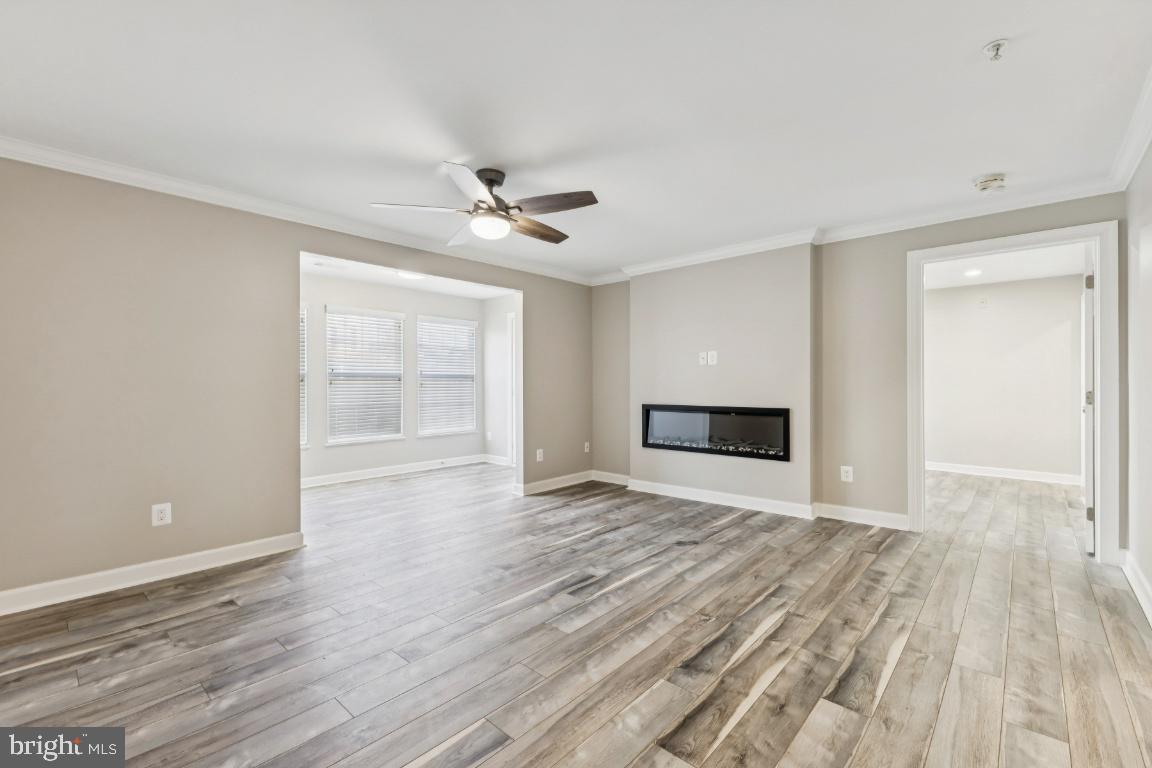 8311 A Bluebird Way, Unit A Lorton, VA 22079 - Photo 6 of 25 a view of empty room with wooden floor and fan