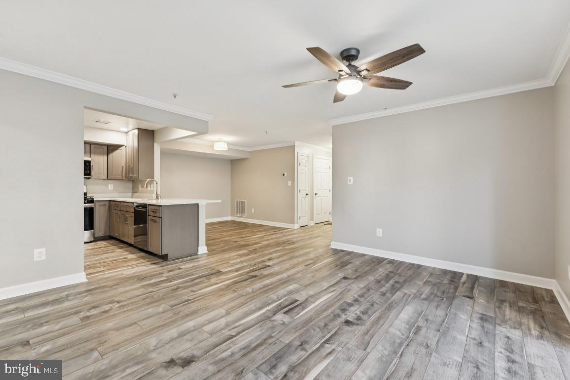 8311 A Bluebird Way, Unit A Lorton, VA 22079 - Photo 8 of 25 a view of a kitchen with a sink and a refrigerator