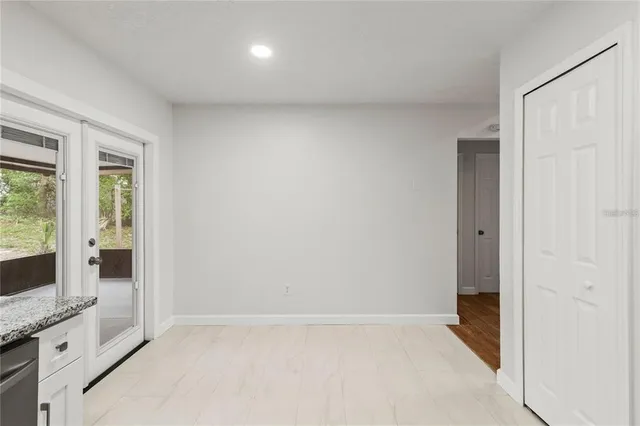 a view of an empty room with a window