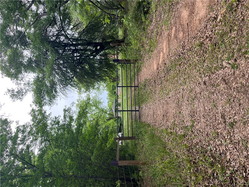 107 Humphrey Wright Road Honea Path, SC 29654 - Photo 3 of 23 A private gated entry leads to this expansive property, offering serene natural beauty and secluded access.
