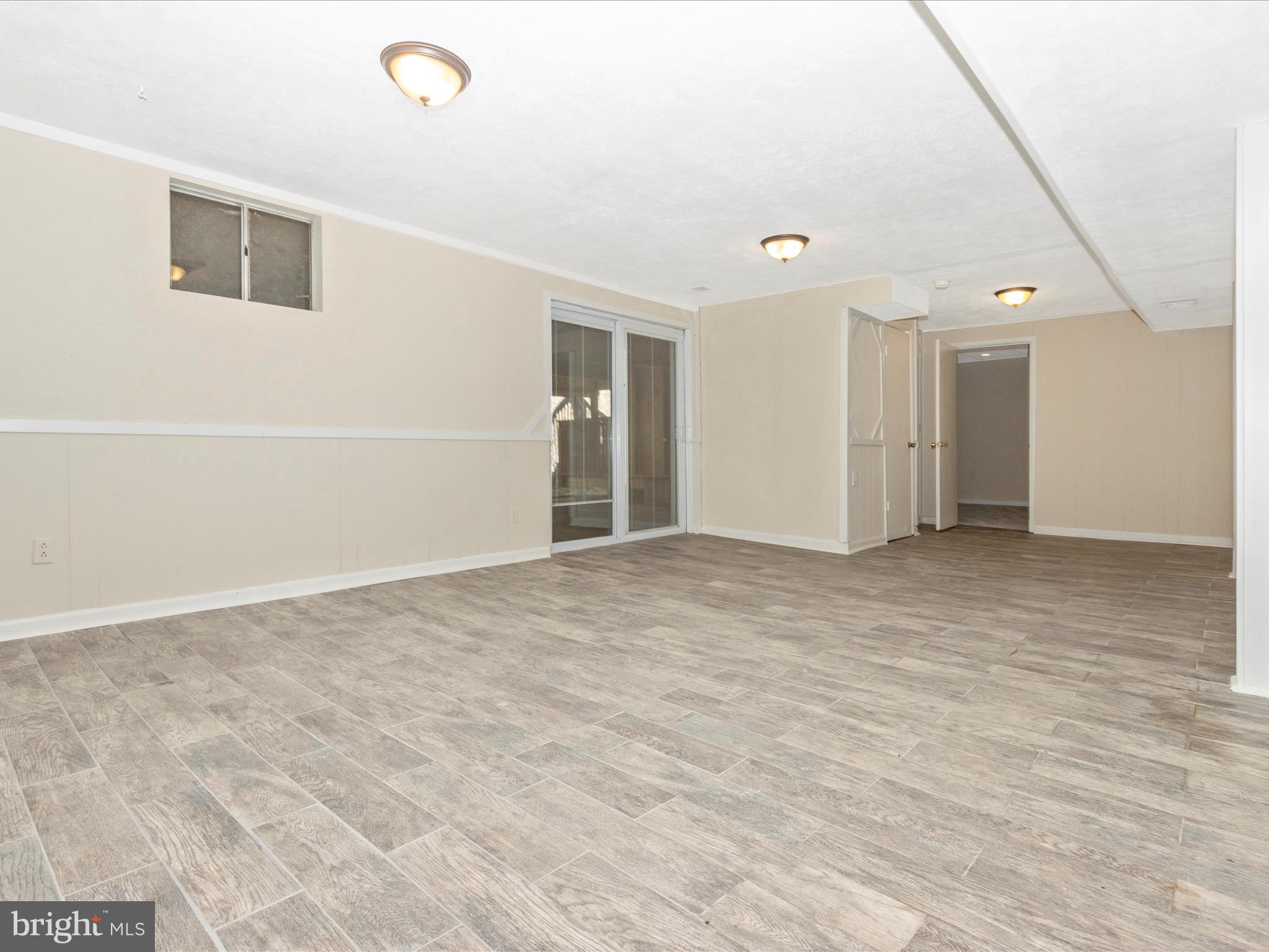 12844 Littleton Street Silver Spring, MD 20906 - Photo 31 of 43 Family Room/rec room with level walkout onto patio