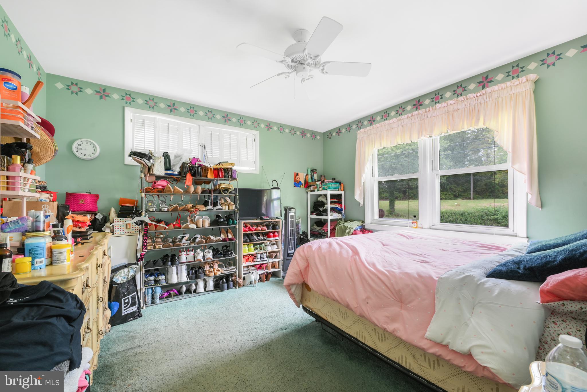 6102 Shady Spring Avenue Baltimore, MD 21237 - Photo 13 of 26 a bed room with a bed and a window