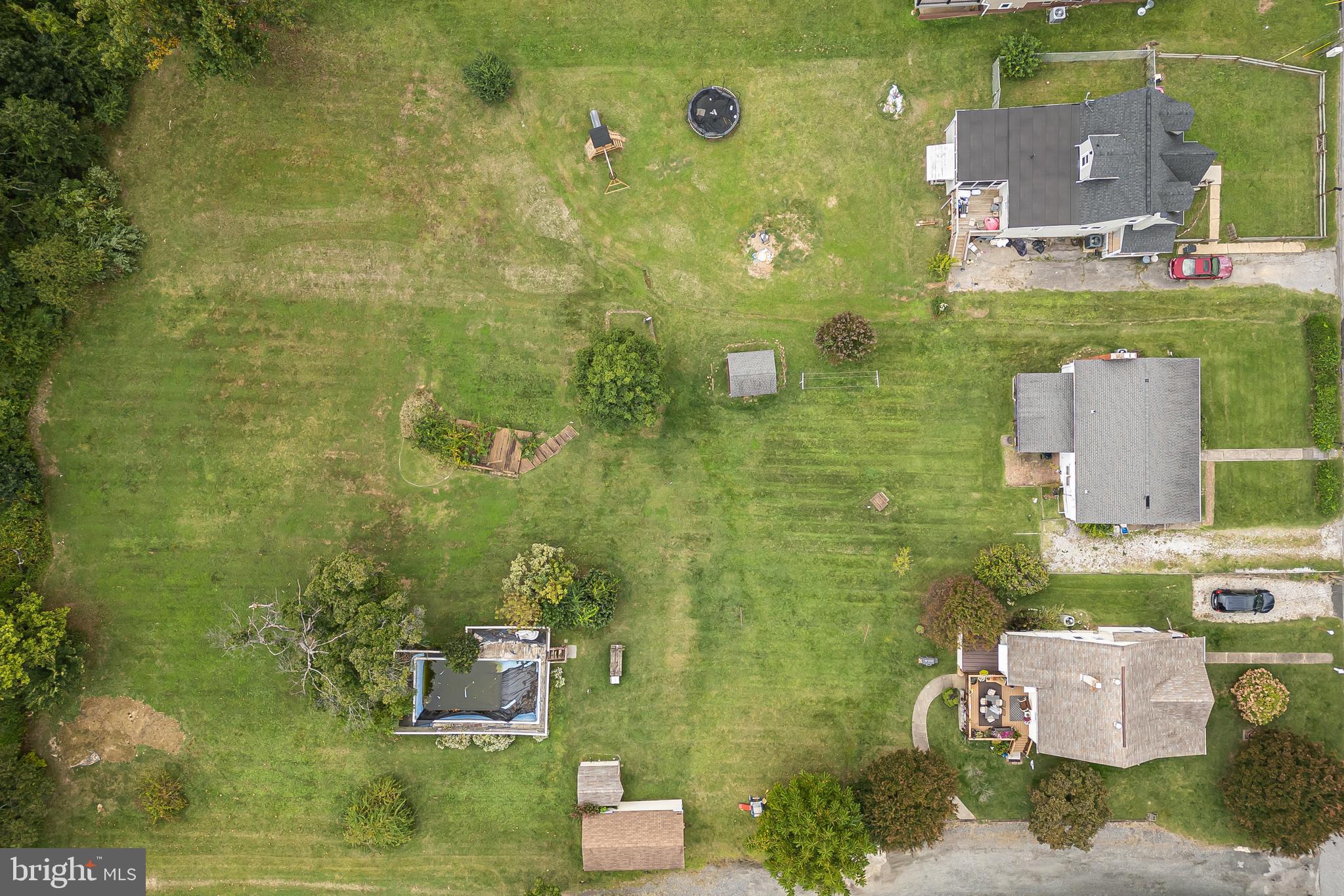 6102 Shady Spring Avenue Baltimore, MD 21237 - Photo 26 of 26 aerial view of a house with a garden