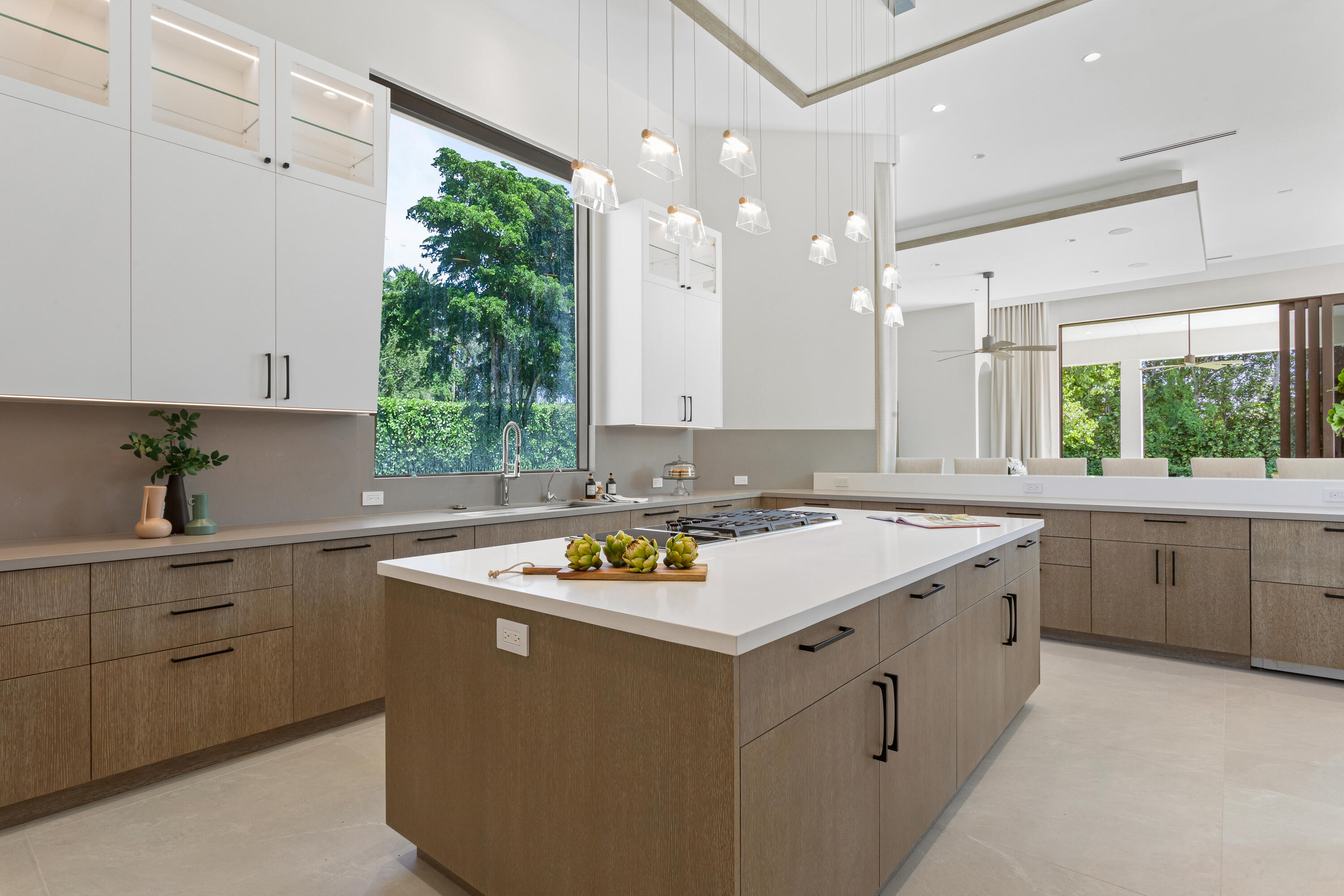 6009 Le Lac Road Boca Raton, FL 33496 - Photo 12 of 35 a kitchen with a stove a sink and a refrigerator