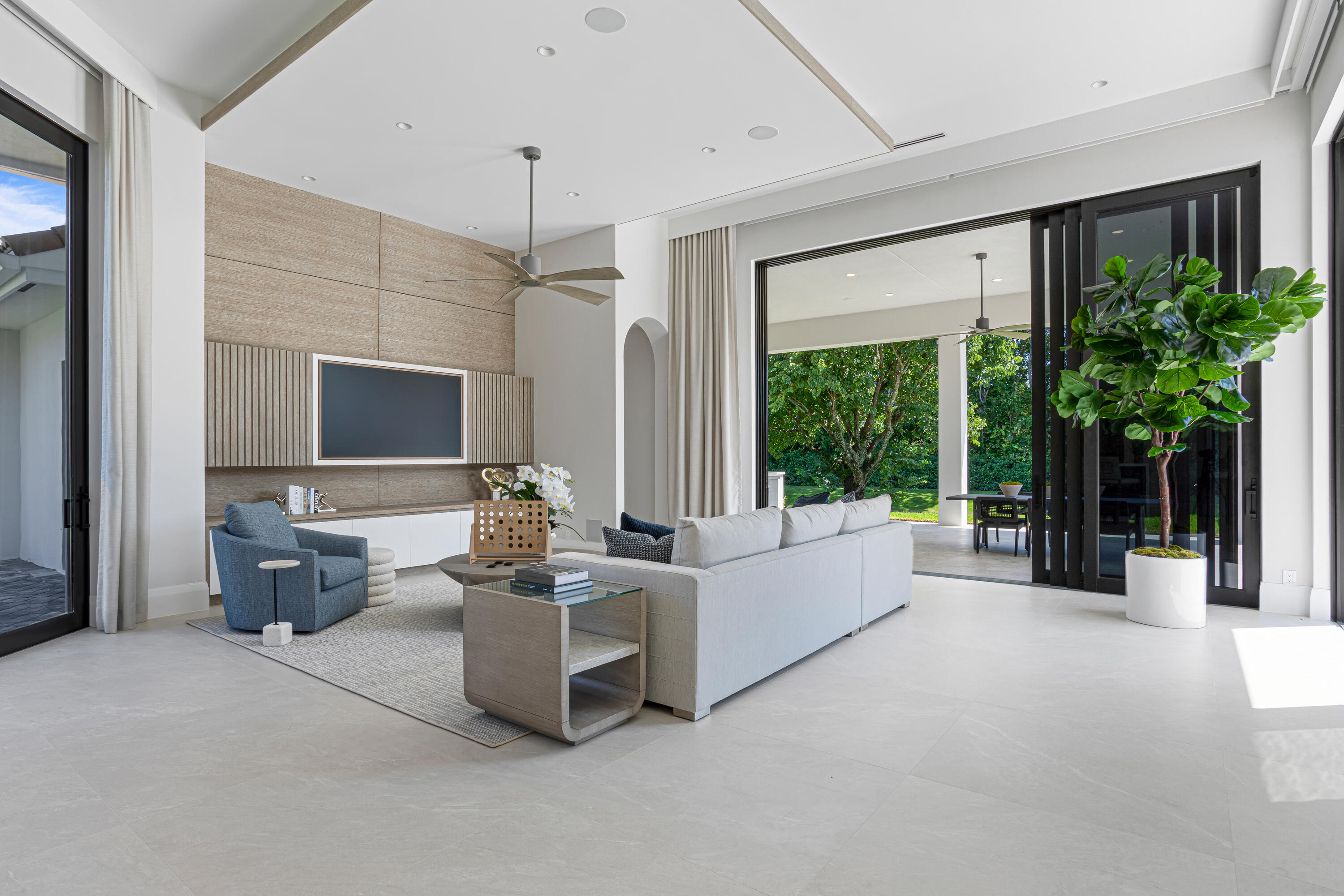 6009 Le Lac Road Boca Raton, FL 33496 - Photo 15 of 35 a living room with furniture large window and flat screen tv