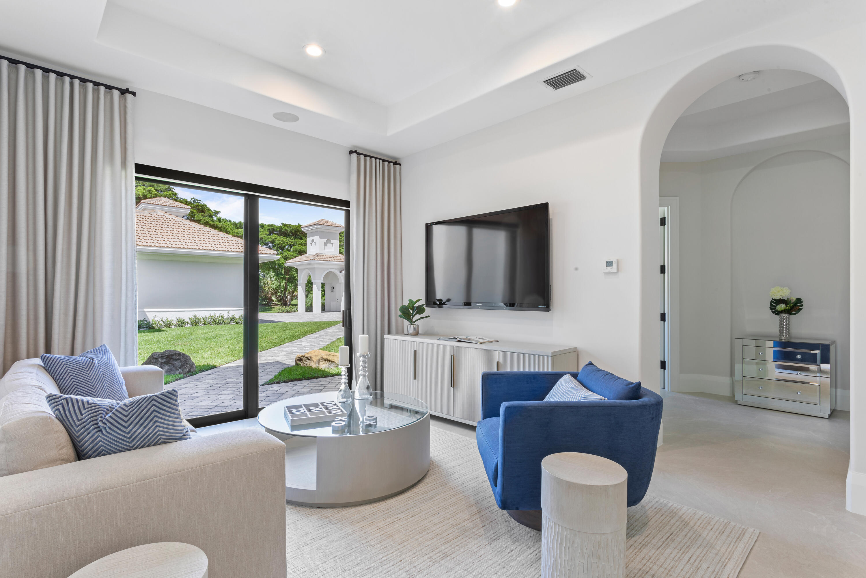 6009 Le Lac Road Boca Raton, FL 33496 - Photo 20 of 35 a living room with furniture and a flat screen tv