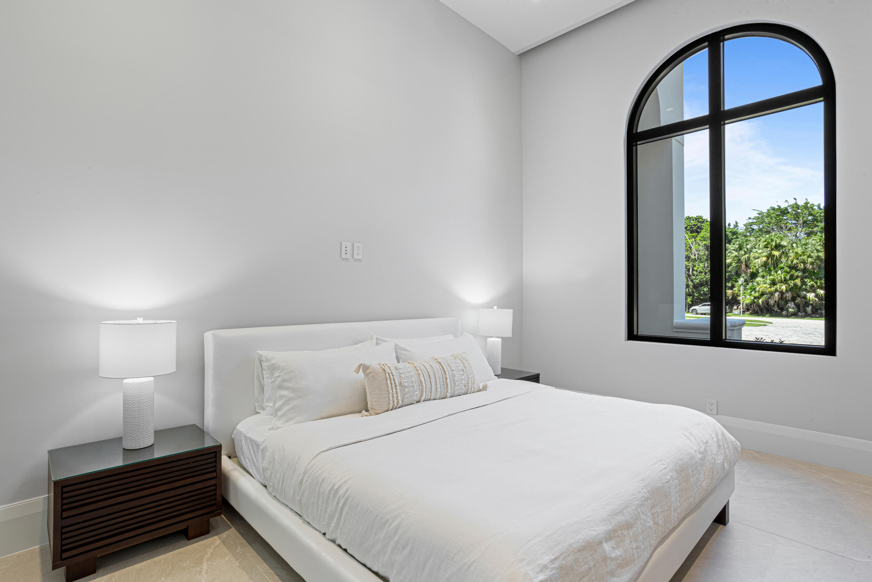 6009 Le Lac Road Boca Raton, FL 33496 - Photo 23 of 35 a bedroom with a bed and a large window