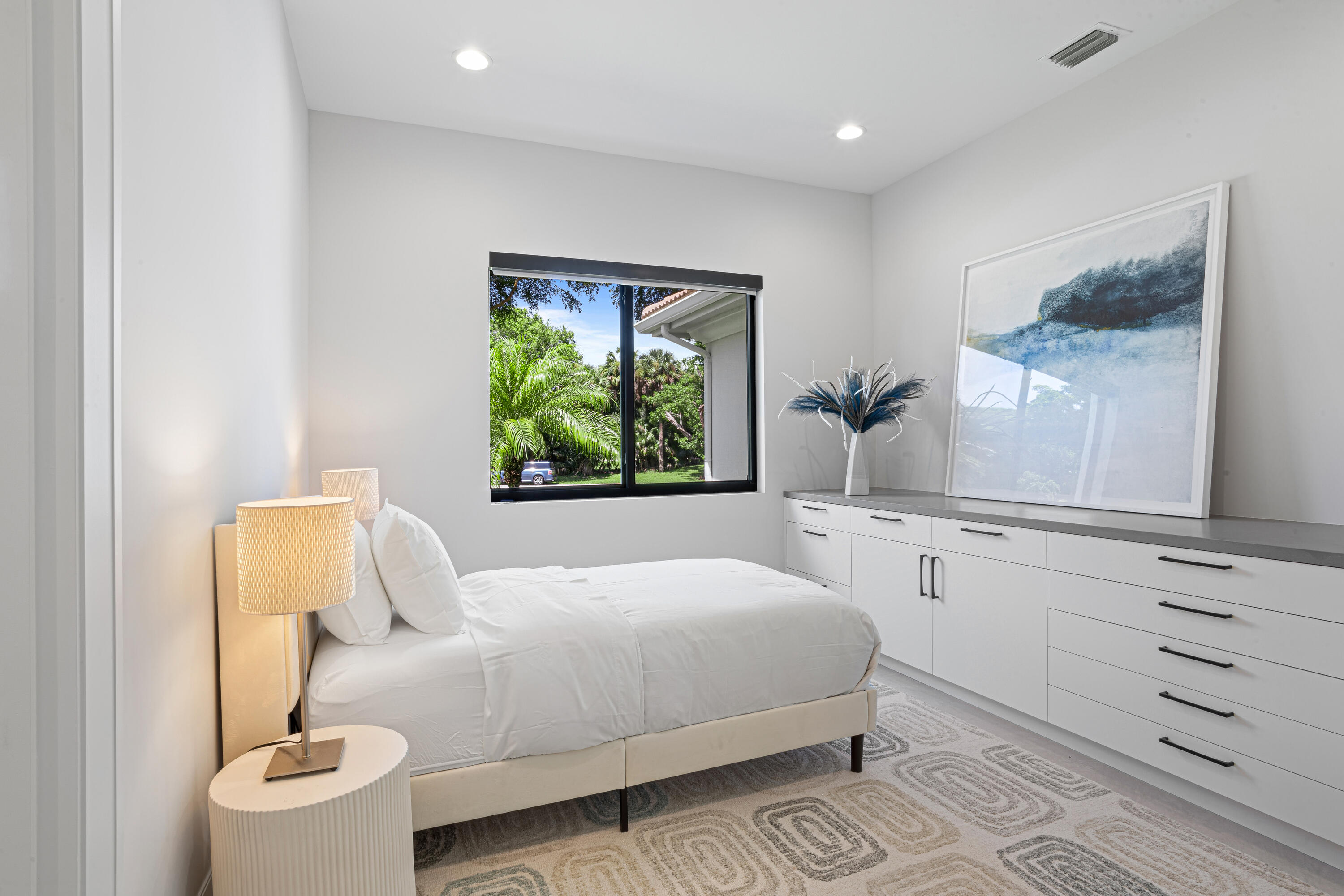 6009 Le Lac Road Boca Raton, FL 33496 - Photo 24 of 35 a bedroom with a bed and a window