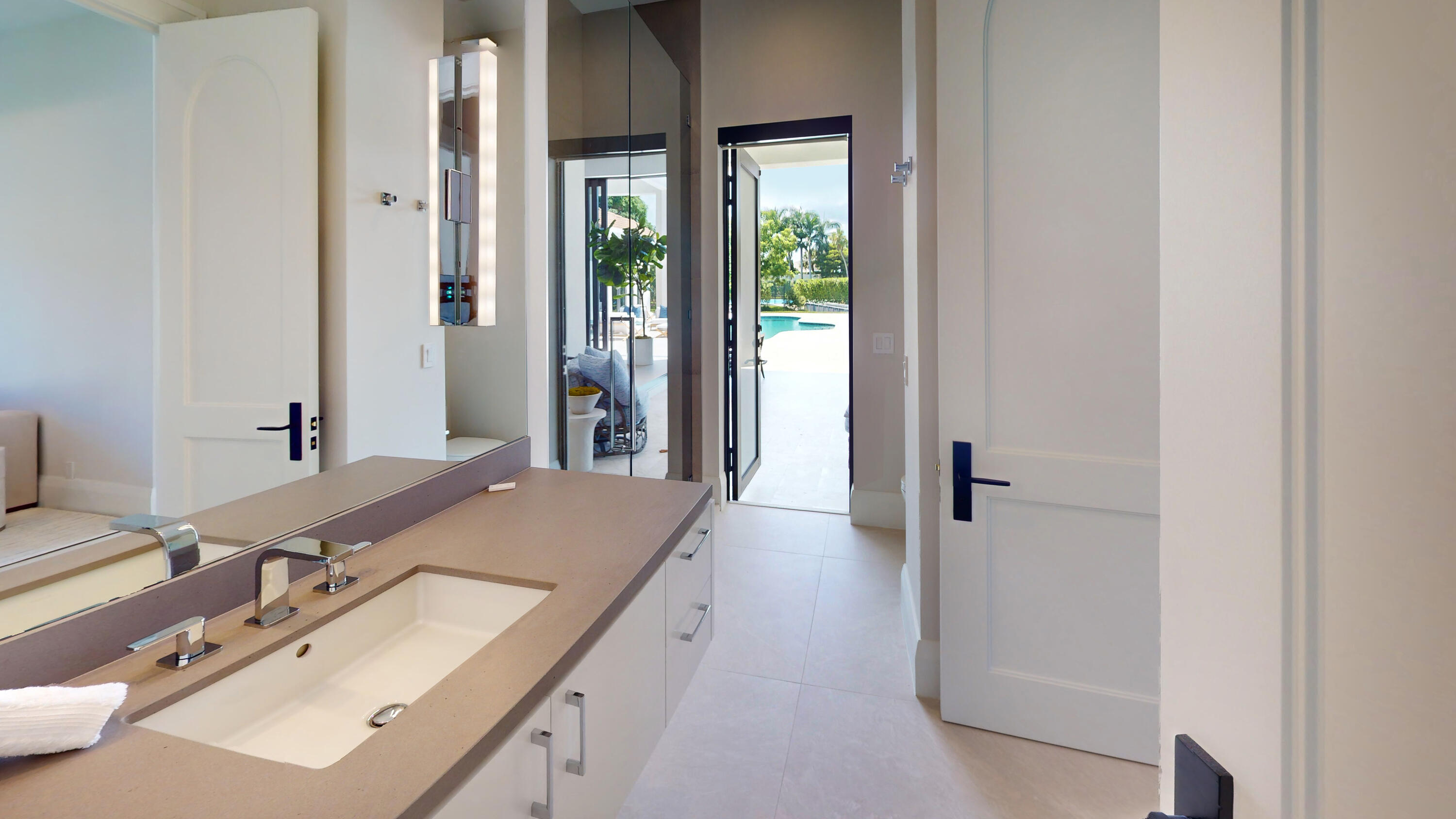 6009 Le Lac Road Boca Raton, FL 33496 - Photo 26 of 35 a en suite bathroom with a sink and a mirror