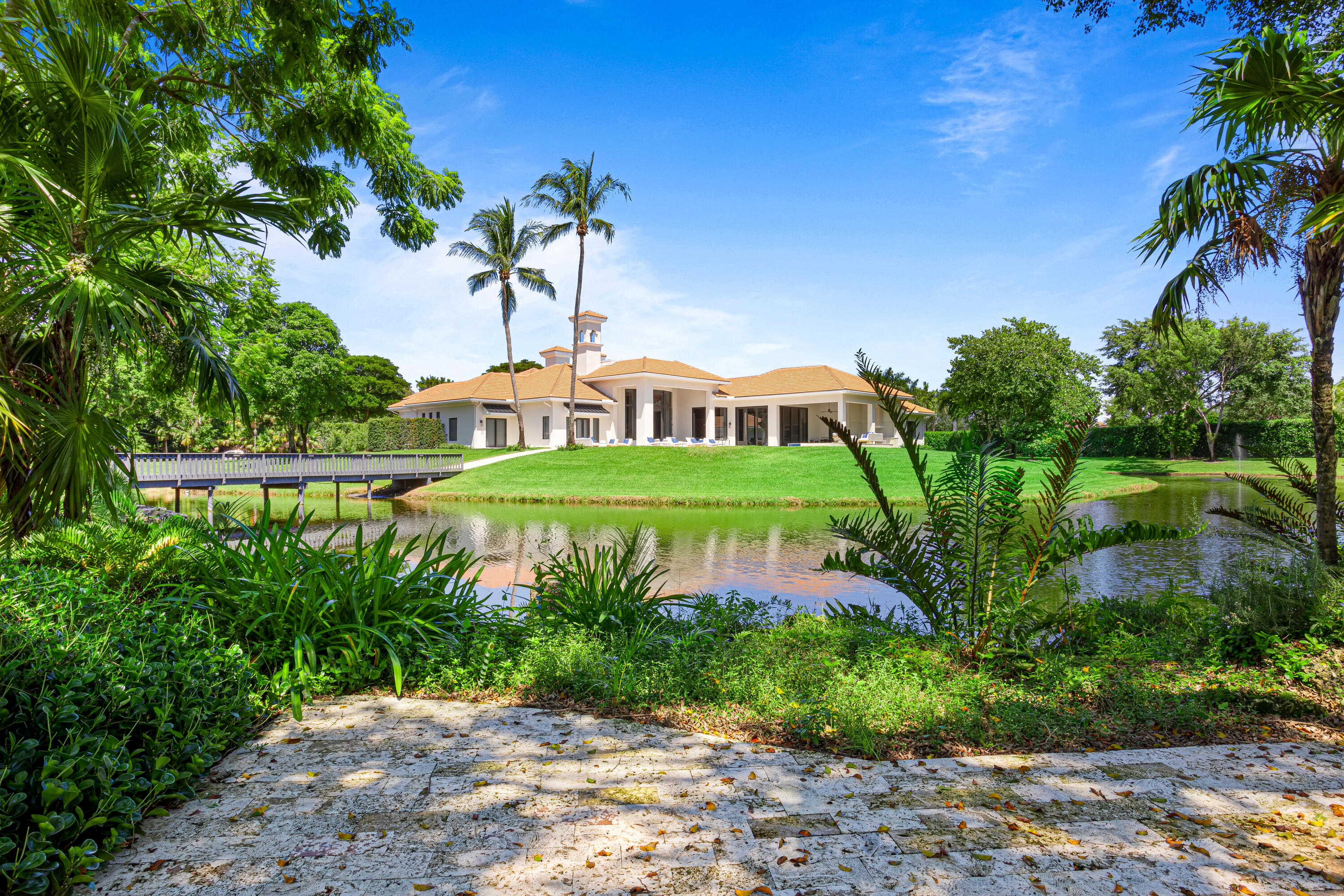 6009 Le Lac Road Boca Raton, FL 33496 - Photo 30 of 35 a view of a lake with a park