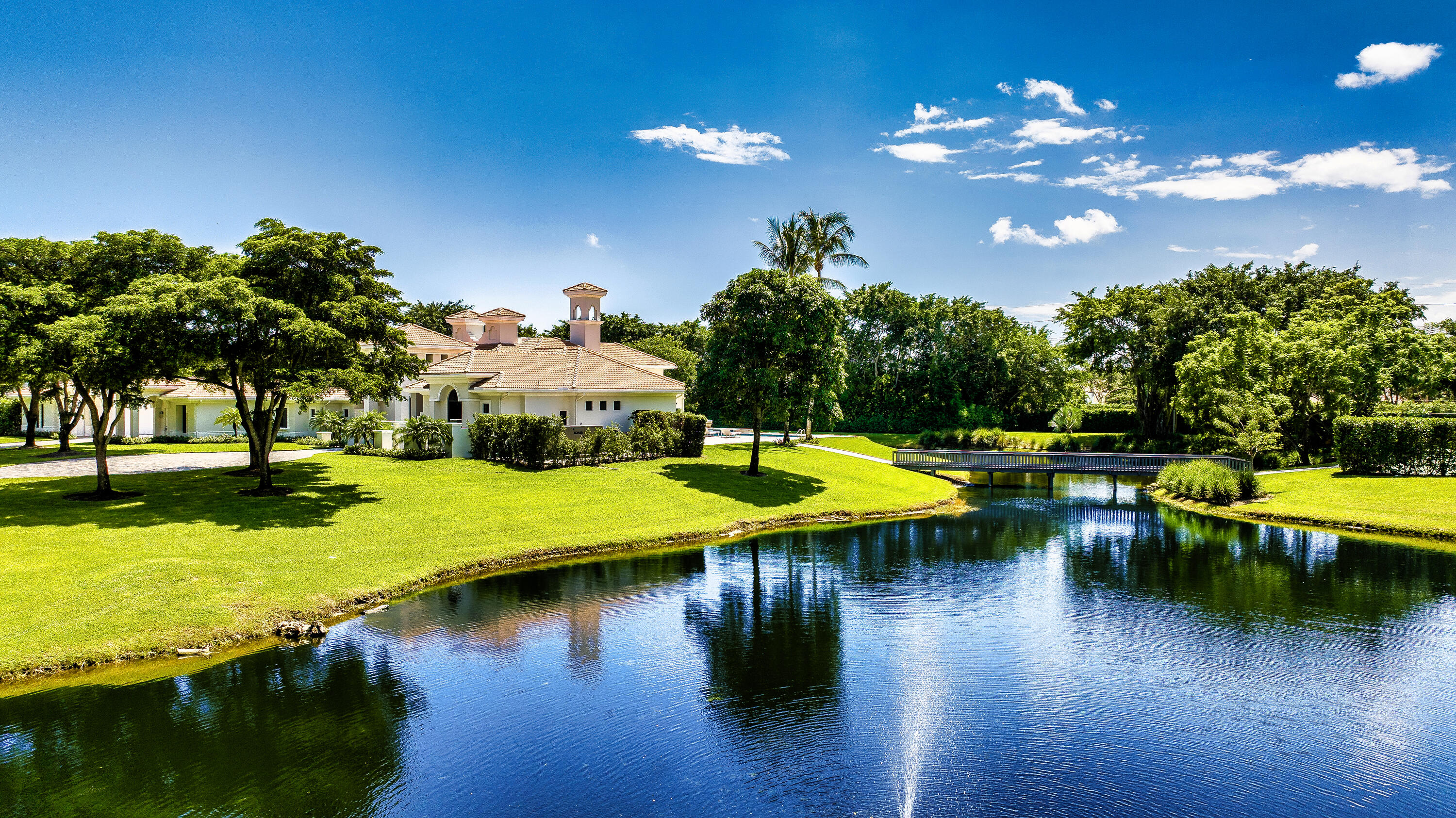 6009 Le Lac Road Boca Raton, FL 33496 - Photo 32 of 35 a view of a swimming pool with lawn chairs with plants