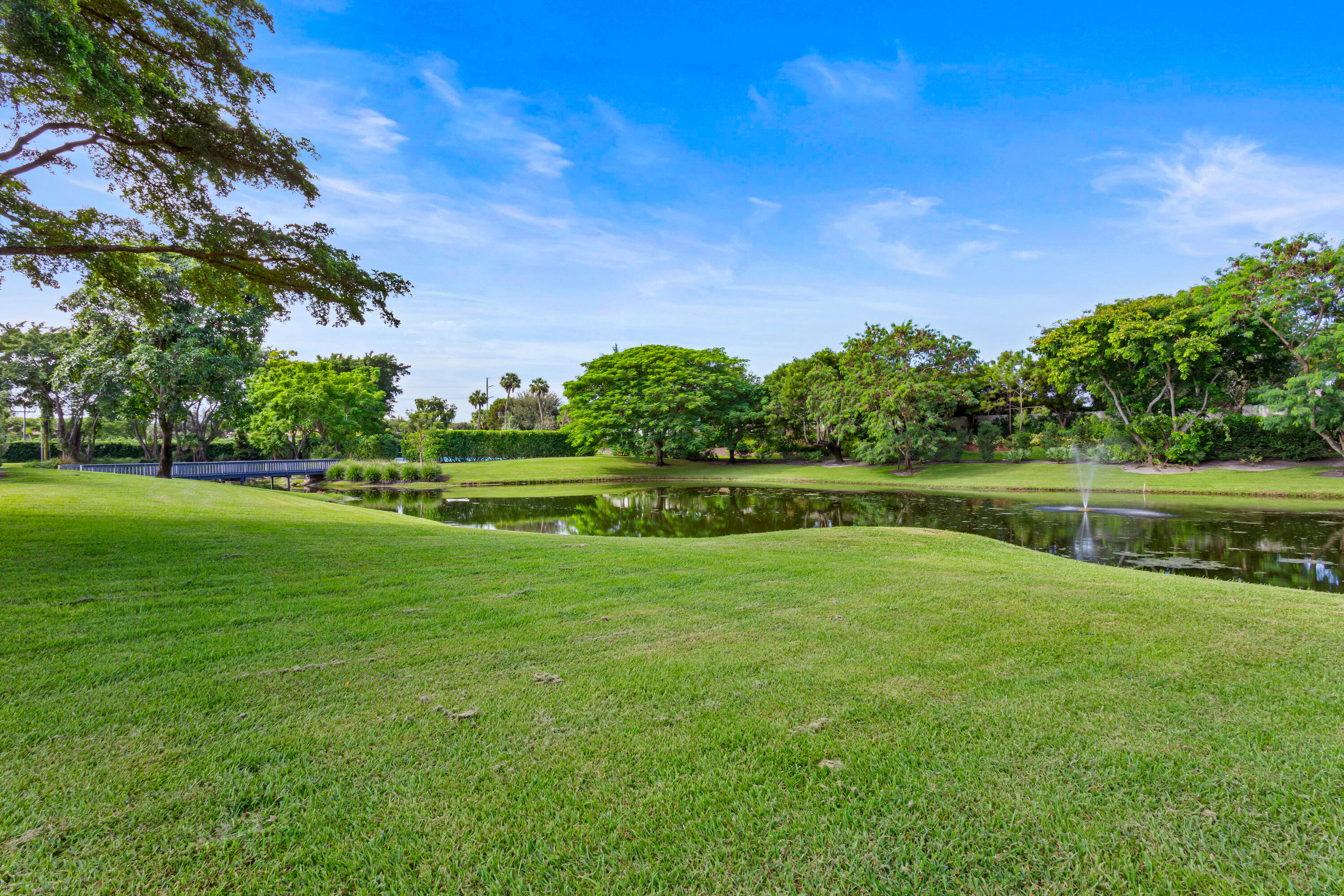 6009 Le Lac Road Boca Raton, FL 33496 - Photo 33 of 35 a view of a golf course with a lake