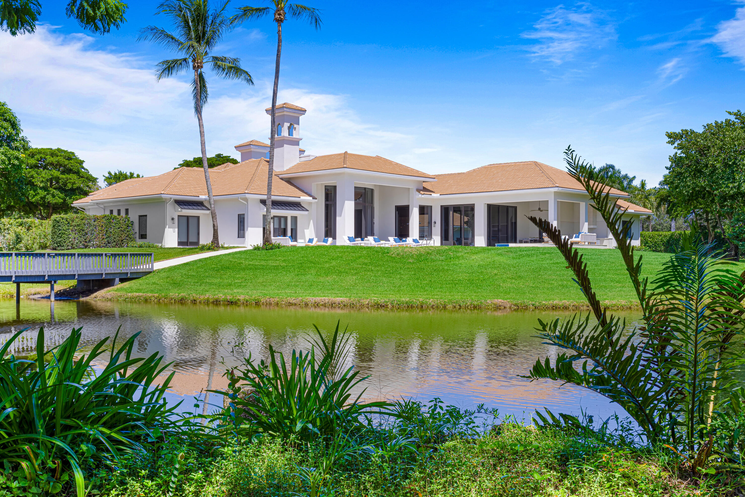 6009 Le Lac Road Boca Raton, FL 33496 - Photo 6 of 35 a front view of a house with garden