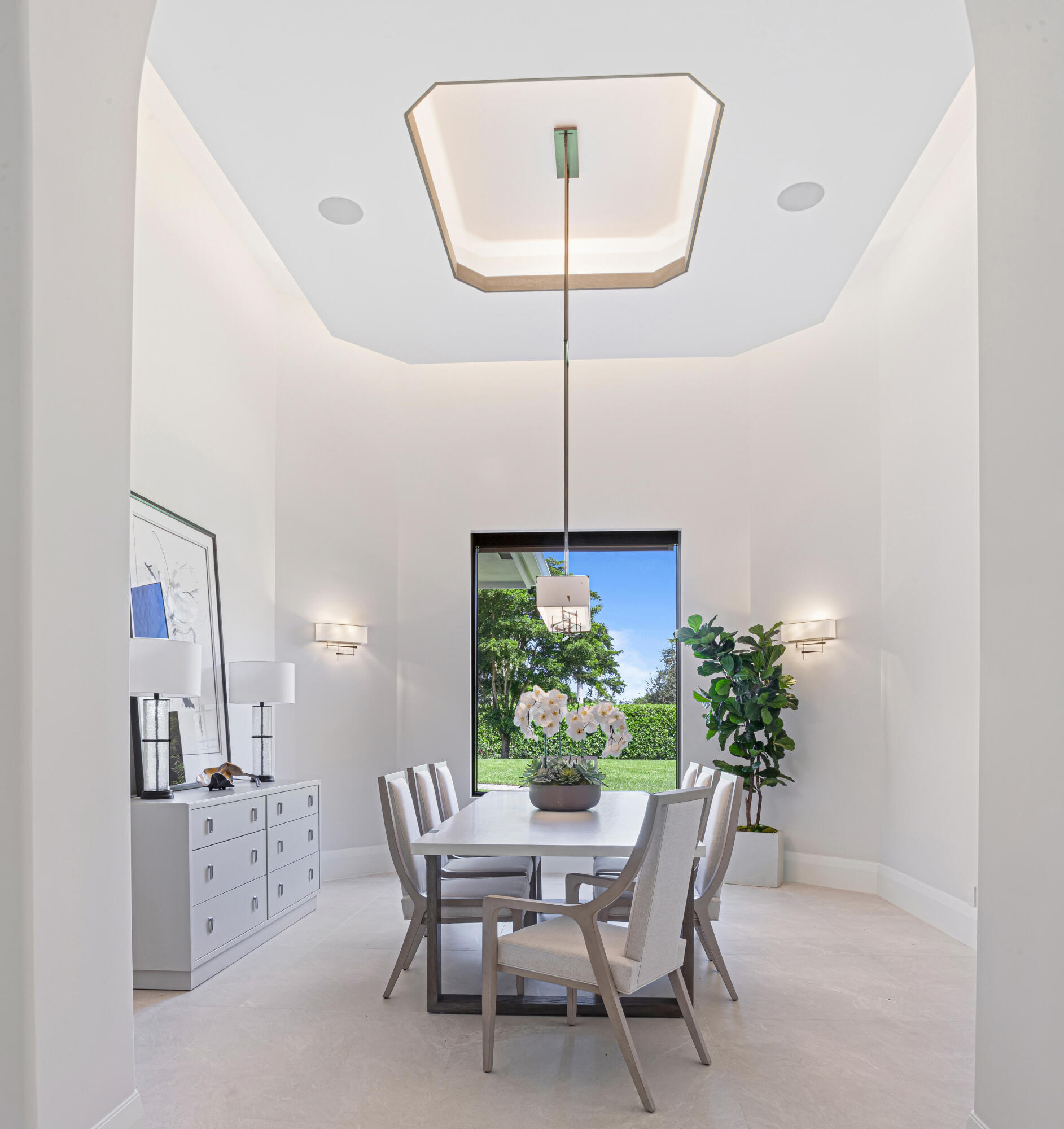 6009 Le Lac Road Boca Raton, FL 33496 - Photo 10 of 35 a dining room with furniture potted plants and a chandelier