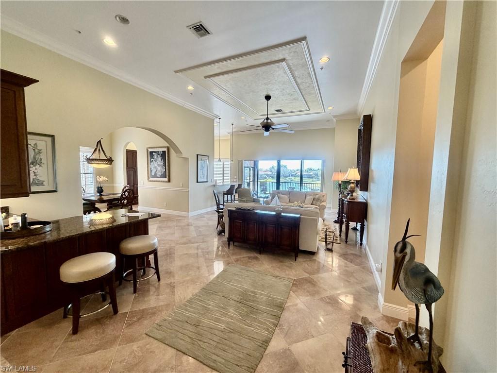 9109 Prima Way, Unit 201 Naples, FL 34113 - Photo 8 of 49 Grand Room, Custom Bar, 13.5' Height Ceilings, Crown & Ceiling Molding