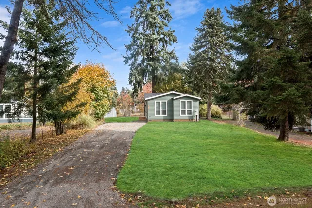 a front view of a house with yard