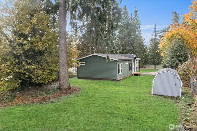 a backyard of a house with a garden and deck