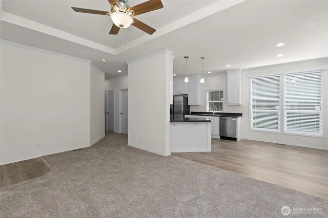 a view of kitchen with refrigerator and window