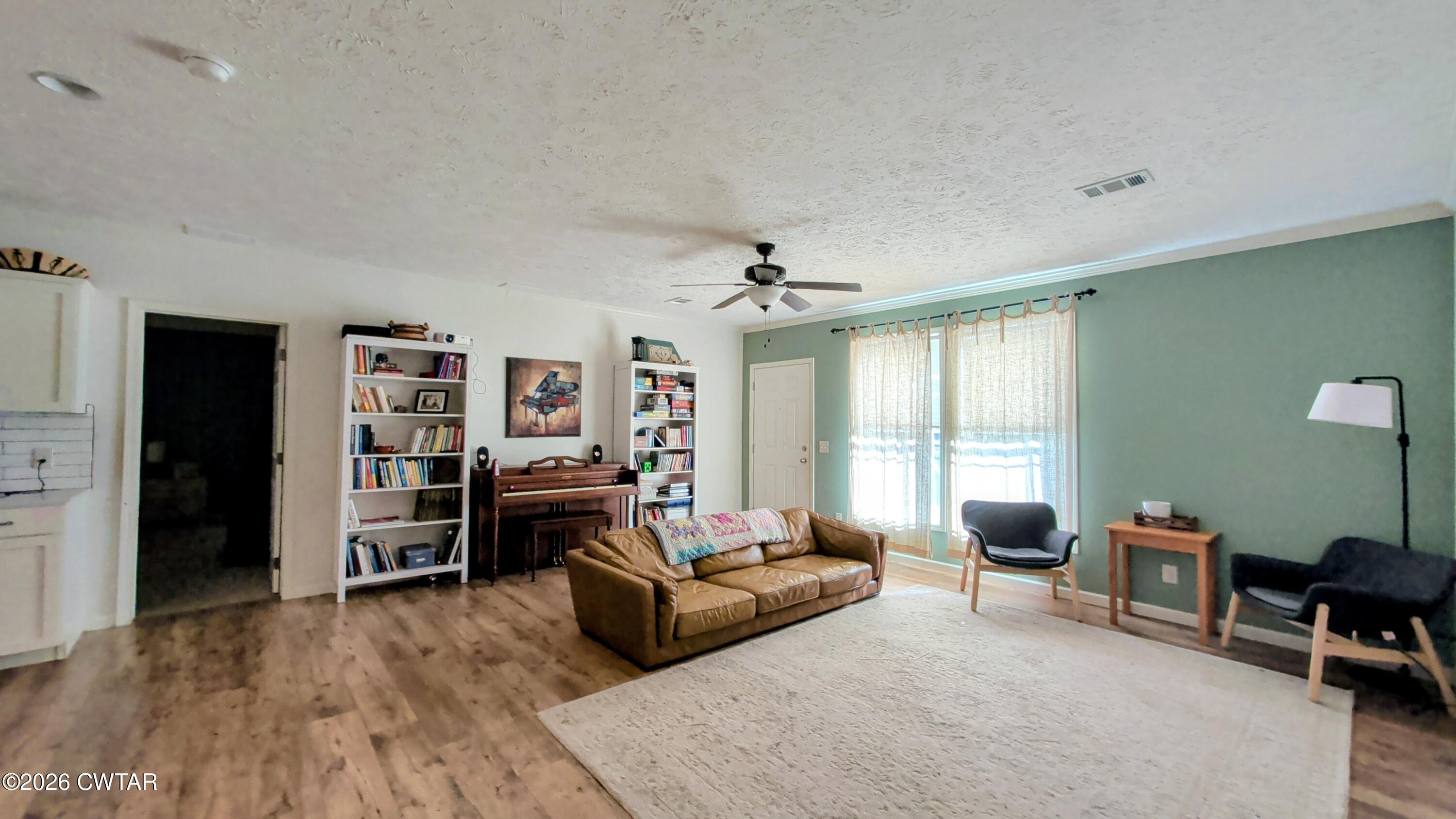 2935 Ed Barham Road Bethel Springs, TN 38315 - Photo 16 of 56 a living room with furniture and a flat screen tv