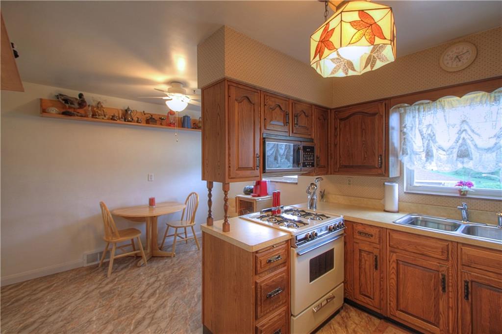 735 Beaver Street Rochester, PA 15074 - Photo 17 of 22 Kitchen & Dining Rooms. Light, bright, airy and neutral. Gas stove, built-in microwave and refrigerator are included.