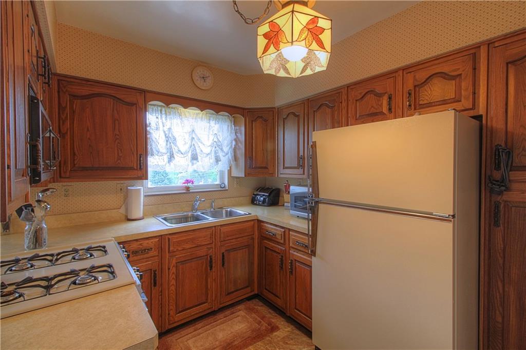 735 Beaver Street Rochester, PA 15074 - Photo 3 of 22 Kitchen up close. Functional design makes cooking and clean-up a breeze! Note the pantry to right of refrigerator.