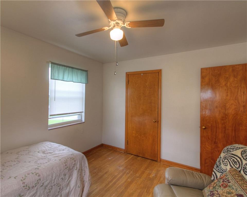 735 Beaver Street Rochester, PA 15074 - Photo 7 of 22 Bedroom 2. Note the original wood doors in good condition complementing the hardwood flooring.