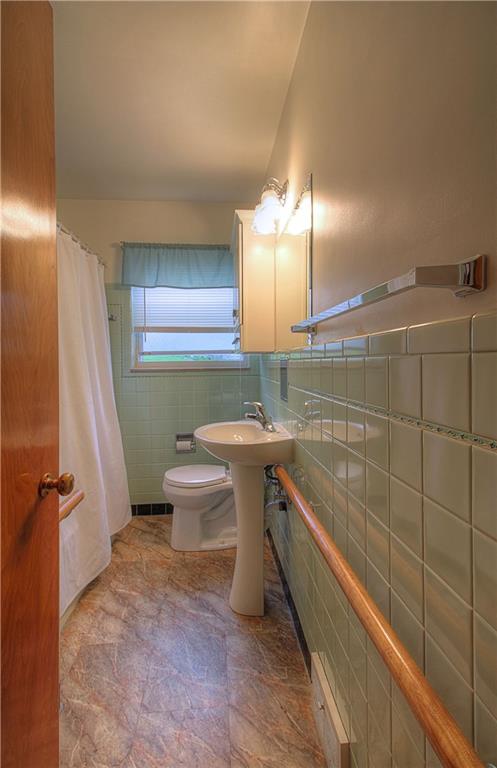 735 Beaver Street Rochester, PA 15074 - Photo 10 of 22 Updated first floor (main) bath features new flooring, pedestal sink and is squeaky clean!