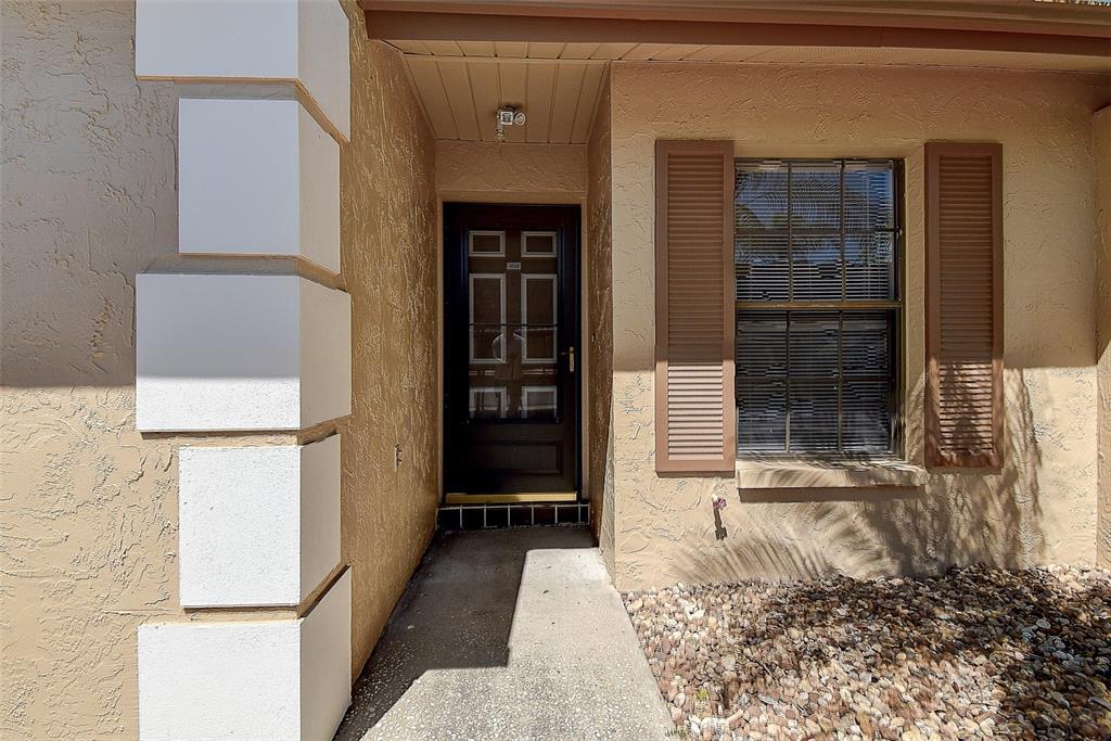 4752 Sunny Loop, Unit 4752 Holiday, FL 34690 - Photo 1 of 28 a view of front door of house