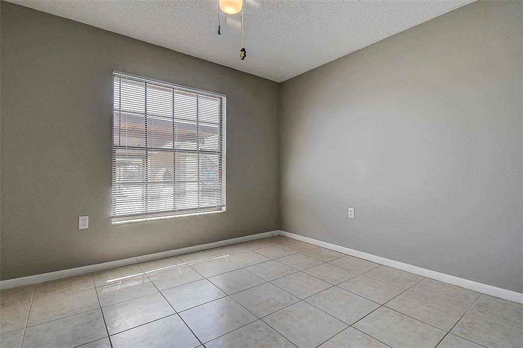 4752 Sunny Loop, Unit 4752 Holiday, FL 34690 - Photo 16 of 28 a view of an empty room with a window