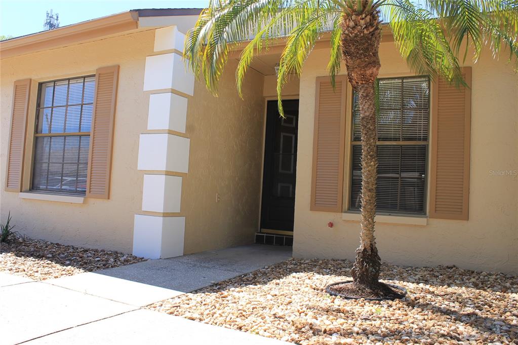 4752 Sunny Loop, Unit 4752 Holiday, FL 34690 - Photo 2 of 28 a front view of a house