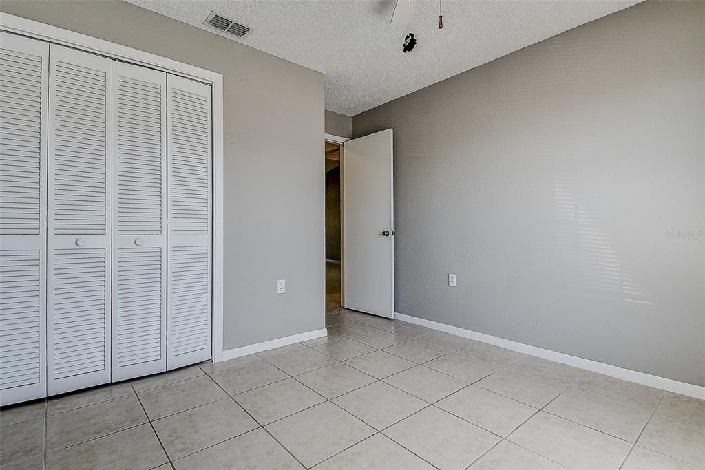 4752 Sunny Loop, Unit 4752 Holiday, FL 34690 - Photo 21 of 28 an empty room with windows