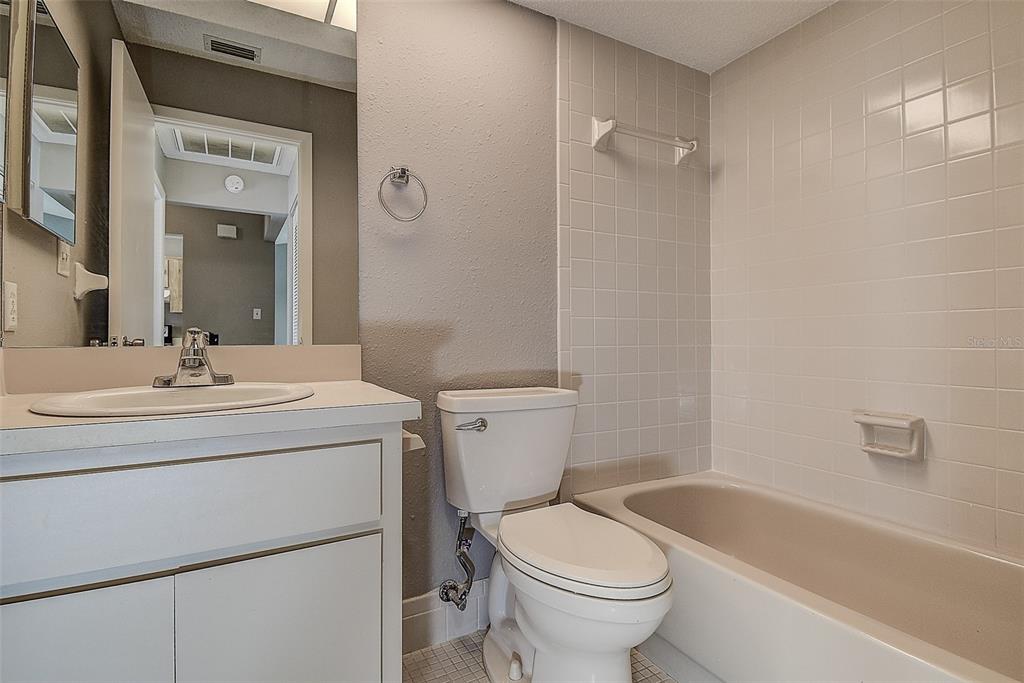 4752 Sunny Loop, Unit 4752 Holiday, FL 34690 - Photo 22 of 28 a bathroom with a sink toilet and shower