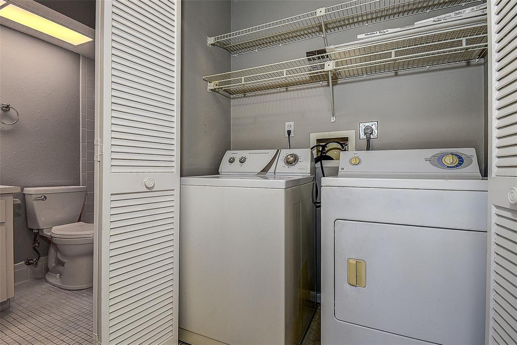4752 Sunny Loop, Unit 4752 Holiday, FL 34690 - Photo 23 of 28 a utility room with dryer and washer