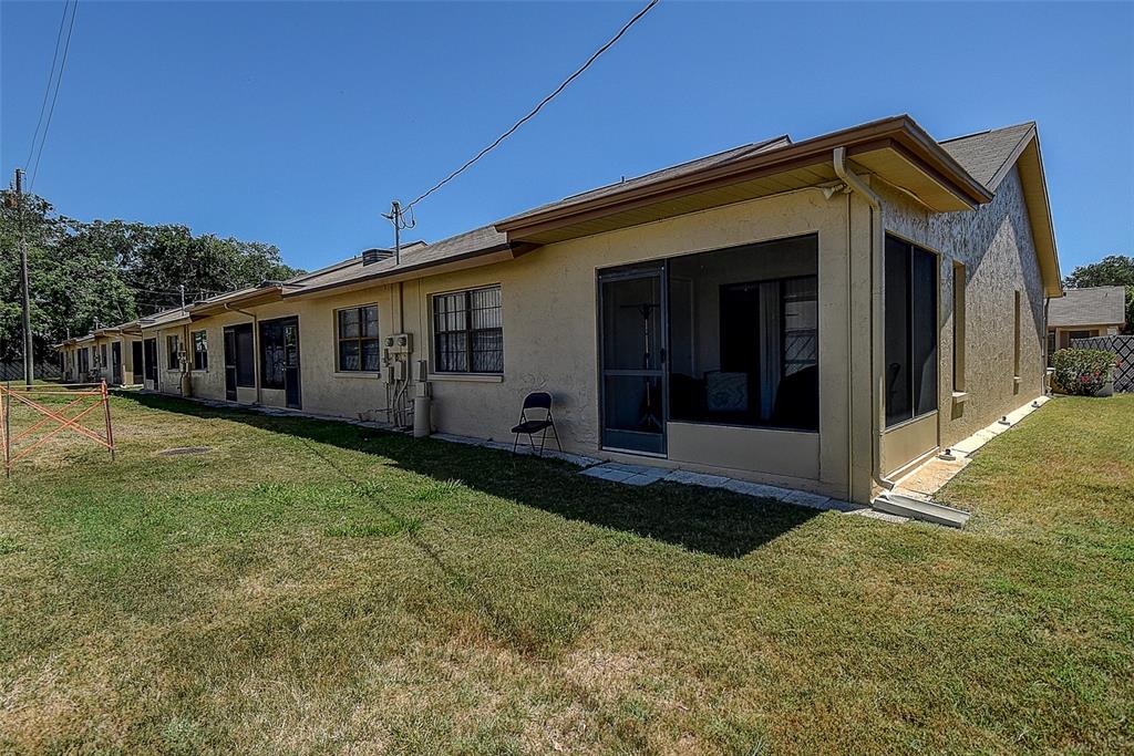 4752 Sunny Loop, Unit 4752 Holiday, FL 34690 - Photo 24 of 28 a view of a house with backyard