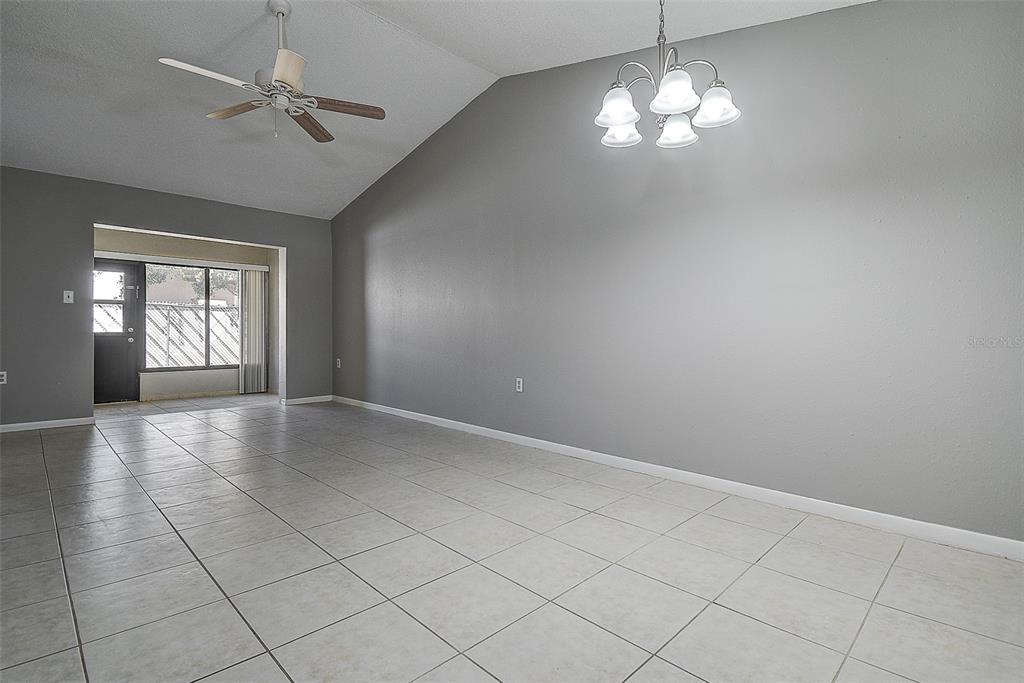 4752 Sunny Loop, Unit 4752 Holiday, FL 34690 - Photo 7 of 28 wooden floor in an empty room with a window